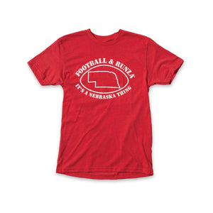 Red t-shirt with text "Football & Runza® it's a Nebraska thing" surrounding a line art drawing of a football around the state of Nebraska. 