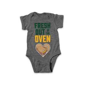 Heather gray onezie with "Fresh Out of the" written in green and "Oven" written in yellow with yellow steam lines on both end. There is a heart made of two Cheese Runza® Sandwiches below the text. 